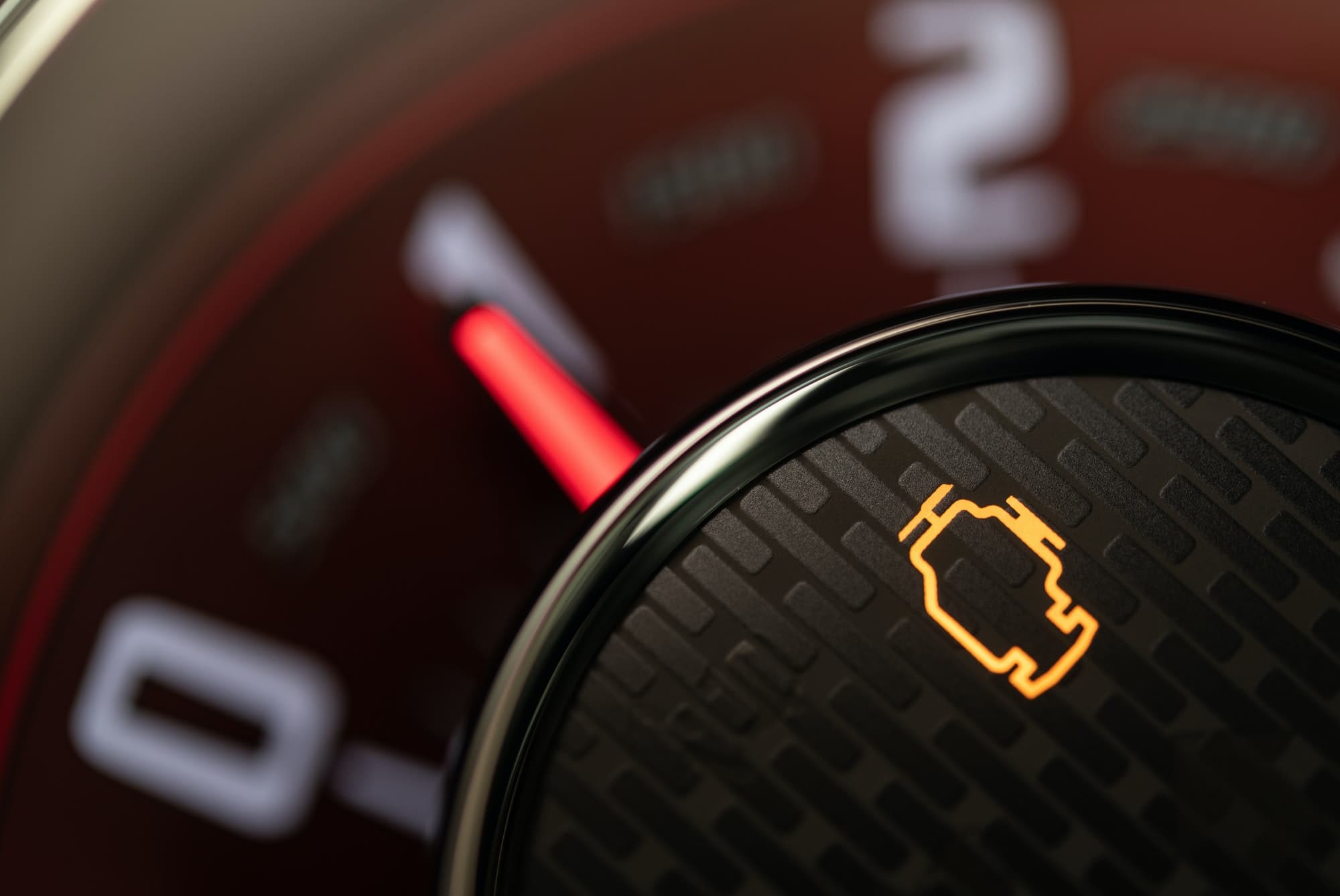 Check engine control light illuminated on a vehicle dashboard